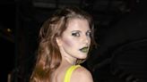 Julia Fox Celebrated Her 34th Birthday In a Neon Yellow Dress and Dark Green Lipstick