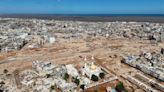 Searchers race to recover bodies in Libyan city where 5,100 died in flooding after 2 dams collapsed