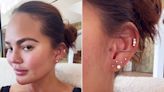 Chrissy Teigen Shares Image of Her Having New Tragus Ear Piercing — Complete with Needle