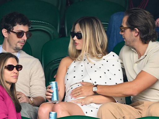 The Way Margot Robbie's Husband Touches Her Baby Bump Is A Sign Of 'Protection'