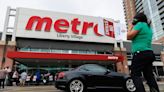 Striking workers demand 'fair share' as Metro reports better-than-expected profits