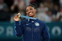 Simone Biles tweets, I love my black job