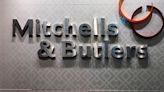 Pub Group Mitchells & Butlers sees annual results at top end of forecast, shares jump