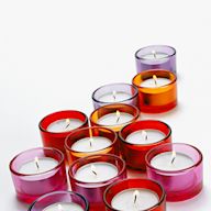Votive candles are small, cylindrical candles that are typically used in decorative holders. They can be unscented or scented and come in a variety of colors. Votive candles are popular for their affordability and versatility.