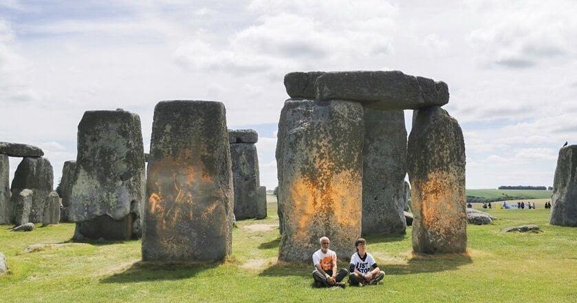 Climate protesters arrested after defacing beloved Stonehenge monument with orange paint