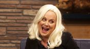 2. Amy Poehler Wears a Black Jacket & Grey Pants