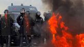 Police fire tear gas at spontaneous anti-pension bill protest in Paris