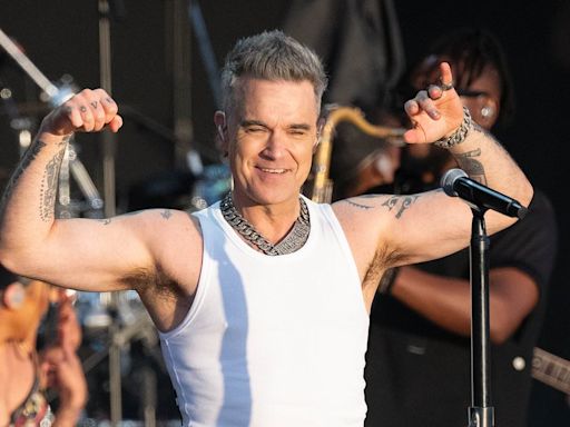 Headliner Robbie Williams' dancer grabs his bottom at BST Hyde Park