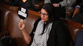 Rep. Rashida Tlaib holds up 'war criminal' sign during Israeli prime minister's speech