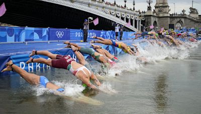 Olympic triathletes swim in Seine River after days of concerns about water quality