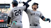 The New York Yankees' Aaron Judge, right, celebrates with Alex Verdugo after hitting a two-run home run against the San Francisco Giants...