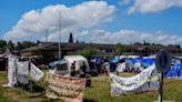 Hundreds of asylum seekers are camped out near Seattle. There’s a vacant motel next door