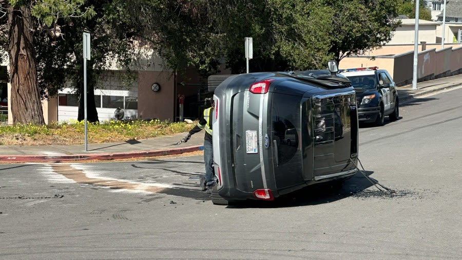 Mother caught in exchange of gunfire flips car near Oakland high school