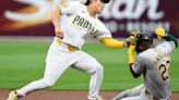 The Oakland Athletics' Miguel Andujar is tagged out on a steal attempt at second base by San Diego Padres shortstop Ha-Seong Kim during the first inning at Petco...