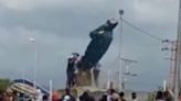 Venezuelan activists topple Hugo Chavez statue amid violence