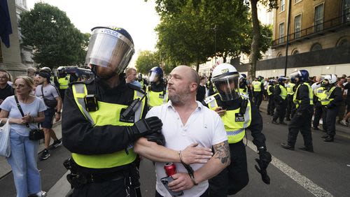 Police in London say a man is arrested after a child and adult were stabbed in a busy square