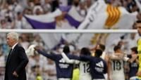 Winning coach: Real Madrid boss Carlo Ancelotti leaves the pitch as players celebrate their victory