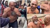 Mike Tyson brawls topless with Shannon Briggs on the street as he returns to his former home