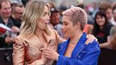 Florence Pugh Helps Emily Blunt Avoid a Wardrobe Mishap After Her Blazer Pops Open at ‘Oppenheimer’ Photocall