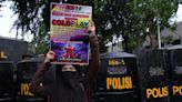 Riot police clash with conservative Muslims protesting outside Coldplay gig in Indonesia