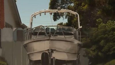 Watch: Man ordered to hide his boat has vessel painted on new fence