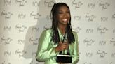 Great Outfits in Fashion History: Brandy in a Lustrous Light-Green Suit