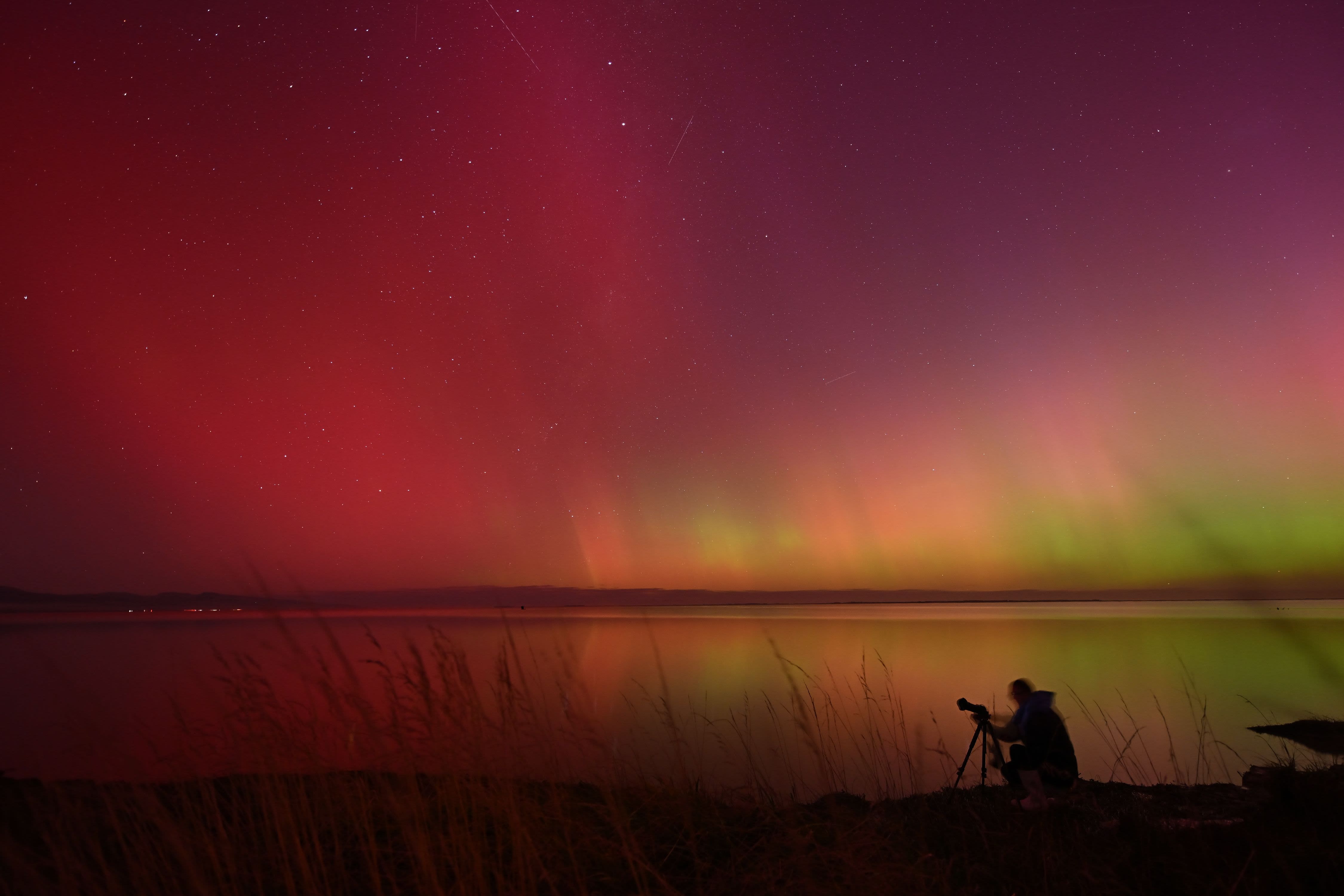 Aurora borealis lights up sky with Northern Lights visible around the world. See photos.