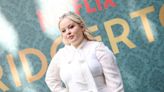 Nicola Coughlan Embraces ’60s Styling in Versace Minidress and Barocco Bow Blouse for ‘Bridgerton’ Season Three Photo Call