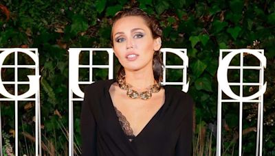 Miley Cyrus Wears Plunging Little Black Dress for Rare Appearance at Star-Studded Summer Party