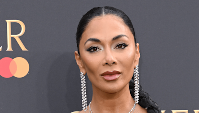 Nicole Scherzinger Shows Off Long Legs in Satin Gown