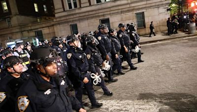 NYPD officers in full riot gear descend on Columbia University campus to clear protesters