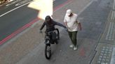 Moment phone thief on electric bike snatches mobile from man's hand