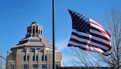 Why are flags flying at half-staff in North Carolina May 15?