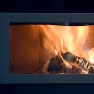 A simple and classic design that lays flat against the fireplace opening. Usually made of metal with a mesh screen to prevent sparks from escaping.