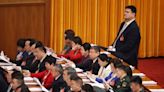 Pictured: Basketball star towers over officials in Chinese congress