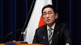 Japan PM purges cabinet in bid to ride out financial scandal