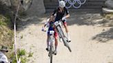 Britain’s Tom Pidcock makes winning pass on final lap to defend his Olympic mountain bike title