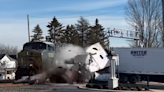 Trucker narrowly escapes before train plows through semi on Ohio tracks, video shows