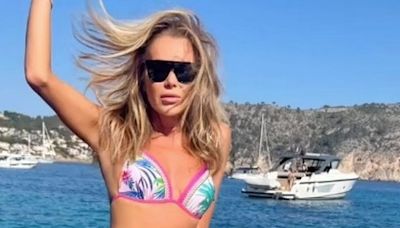 Amanda Holden, 53, branded 'stunning' by fans as she poses on yacht in tiny bikini