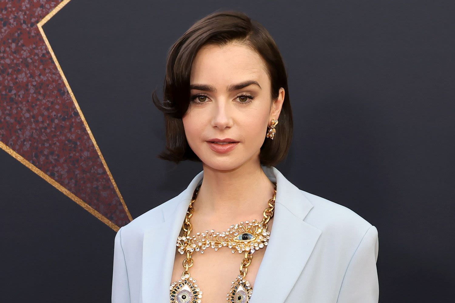 Lily Collins Debuts Shorter Hairstyle in Sexy Statement Look on 'MaXXXine' Red Carpet