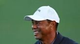 Tiger Woods, a 15-time major winner and five-time Masters champion, laughs during his warm-up work at Augusta National before the resumption of the opening round of the 88th Masters