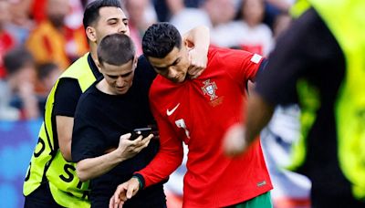 Uefa increases security after Cristiano Ronaldo confronted by six pitch invaders