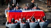 Chileans throng streets for former president's funeral procession