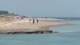 ‘I can’t get out’: Woman walking on popular beach gets trapped in quicksand up her waist