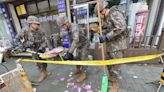 Trash dropped by a North Korean balloon falls on South Korea’s presidential compound