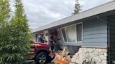 Driver injured after truck crashes into Edmonds home