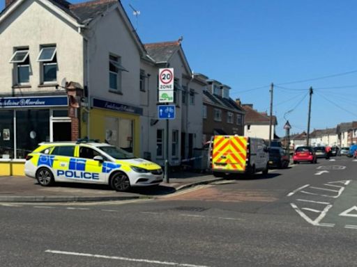 Cafe cordoned off by police as forensics examine inside