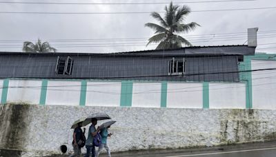 Landslides caused by heavy rains kill 8 and bury many others in southern India