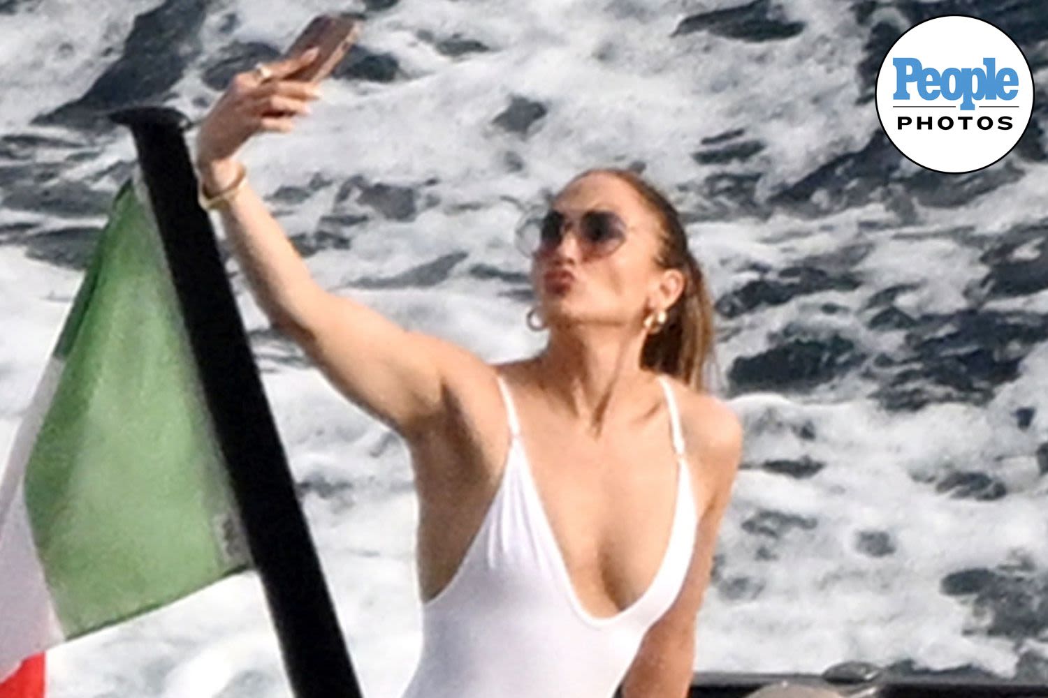 Jennifer Lopez Snaps Selfies and Poses on Bow of a Boat in Italy During Solo Summer Vacation