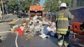 Garbage truck catches fire in DC, trash dumped onto street